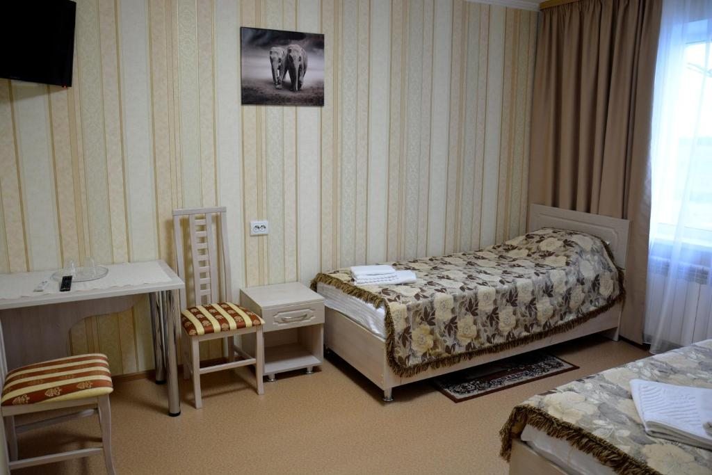 Двухместный (Улучшенный двухместный номер с 2 отдельными кроватями) отеля Славянка Нижнедевицк, Нижняя Ольшанка
