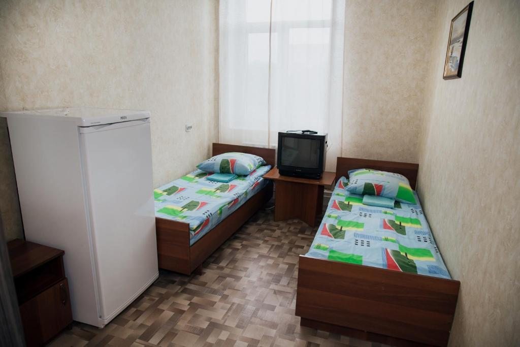 Двухместный (Стандартный двухместный номер с 2 отдельными кроватями и общей ванной комнатой) отеля Энергия, Сызрань