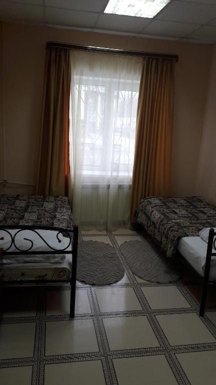 Номер (Односпальная кровать в общем номере для женщин с общей ванной комнатой) отеля Сфера, Солнечногорск