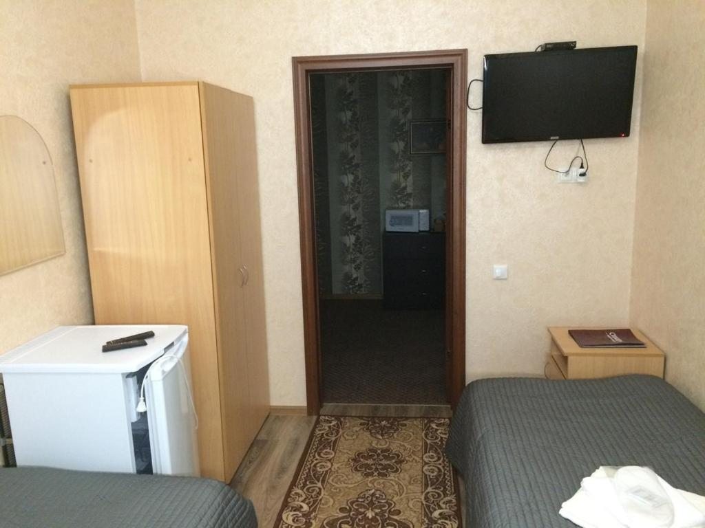 Номер (Односпальная кровать в общем номере) отеля Сибирь на Строителей, Тарко Сале