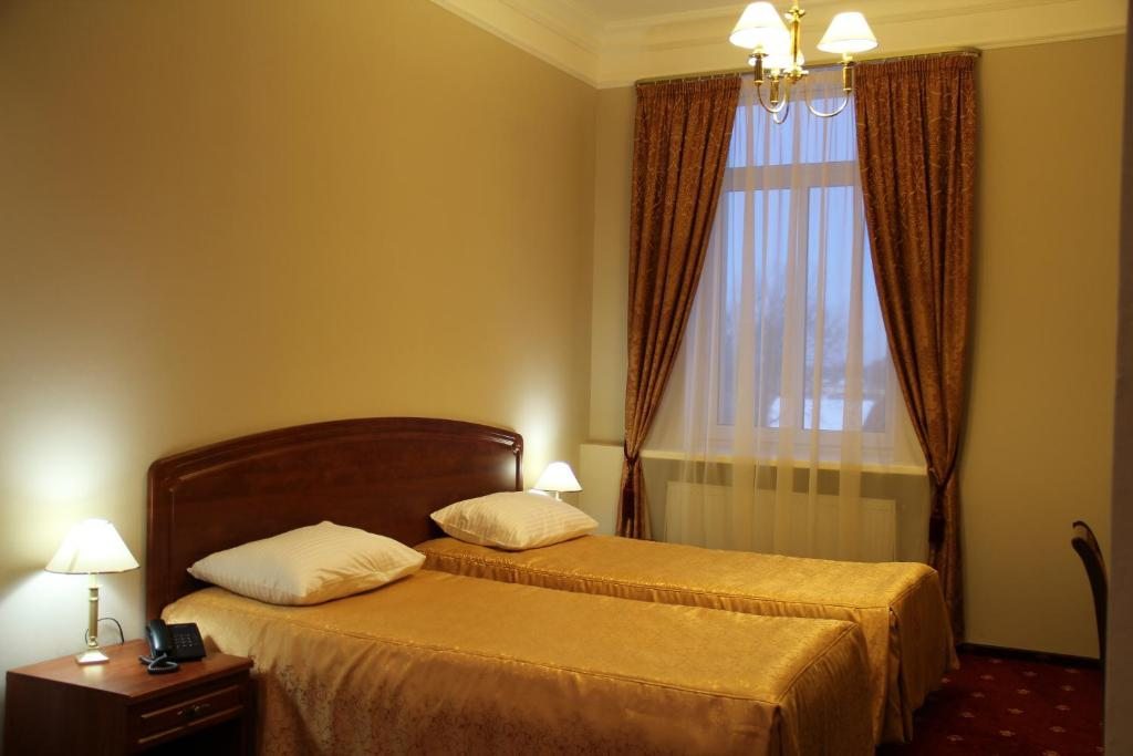 Двухместный (Стандартный двухместный номер с 2 отдельными кроватями) отеля Тосно