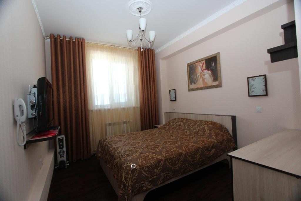 Двухместный (Двухместный номер Делюкс с 1 кроватью и душем) отеля Е-Отель Муравленко