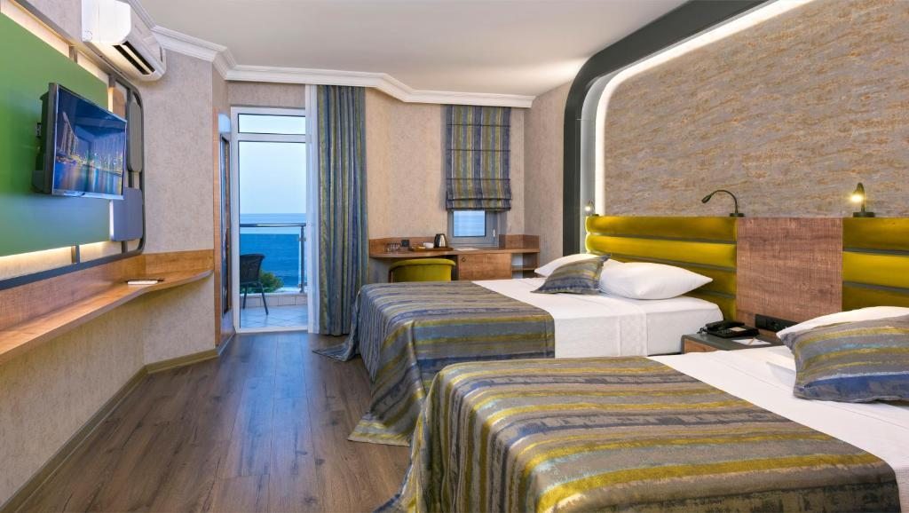 Двухместный (Улучшенный двухместный номер с 1 кроватью или 2 отдельными кроватями и видом на море) отеля Monart City, Алания