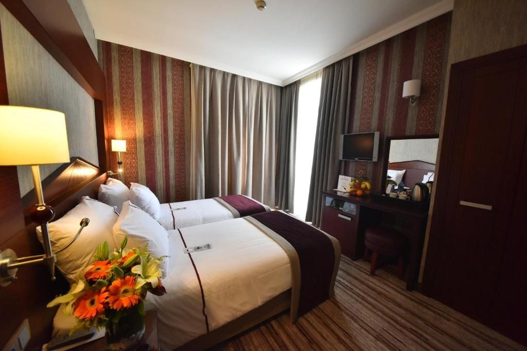 Двухместный (Стандартный двухместный номер с 1 кроватью или 2 отдельными кроватями - Бесплатное посещение спа-салона) отеля Taksim Gonen, Стамбул