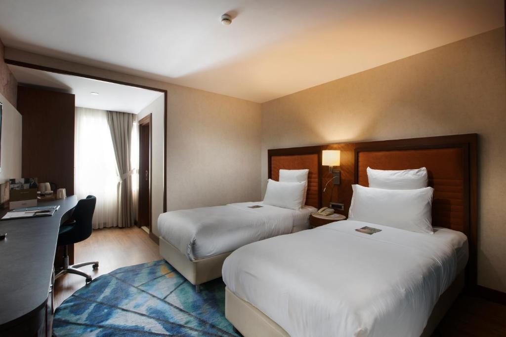 Двухместный (Улучшенный двухместный номер с 2 отдельными кроватями и правом бесплатного посещения спа-салона) отеля Blue Regency, Стамбул