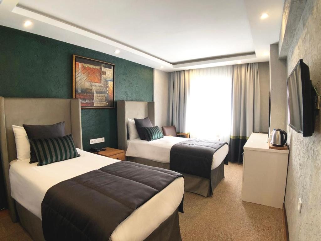 Двухместный (Улучшенный двухместный номер с 1 кроватью или 2 отдельными кроватями) отеля Carlton, Стамбул