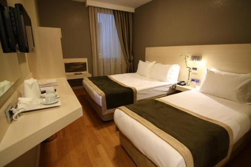 Двухместный (Стандартный двухместный номер с 1 кроватью или 2 отдельными кроватями) отеля Troya, Стамбул