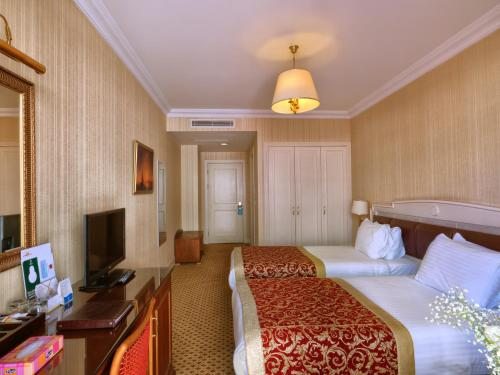 Двухместный (Улучшенный двухместный номер с 1 кроватью или 2 отдельными кроватями) отеля Taksim Metropark Hotel, Стамбул