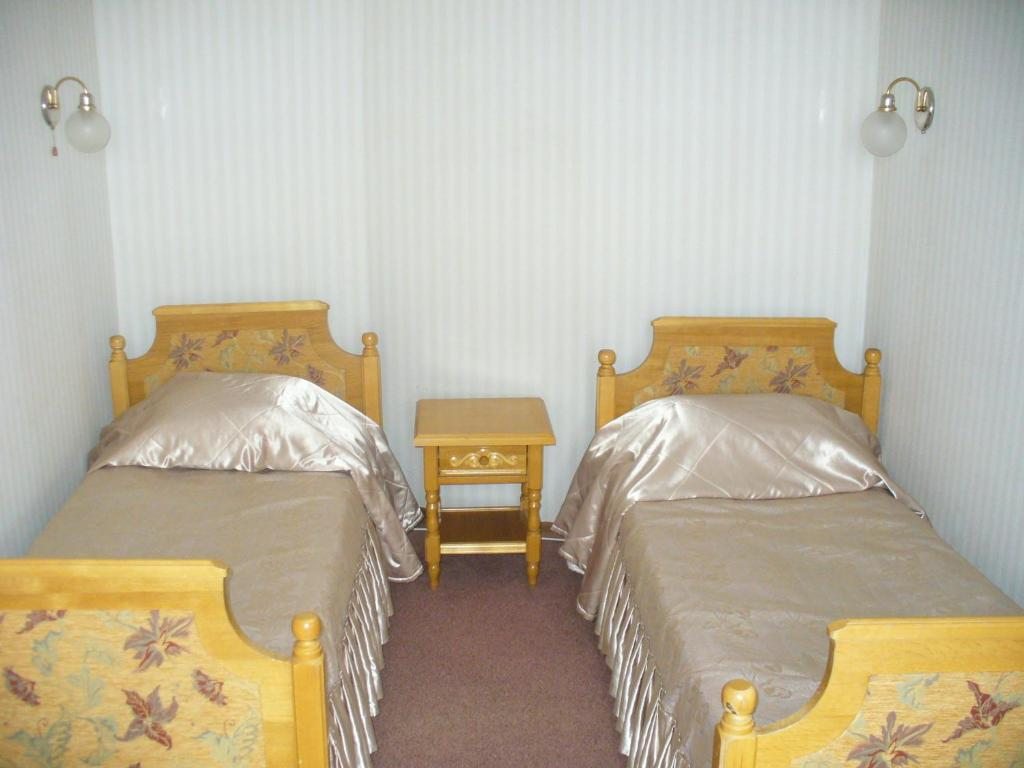 Двухместный (Стандартный двухместный номер с 2 отдельными кроватями) отеля Постоялый двор ГРИНН, Свобода