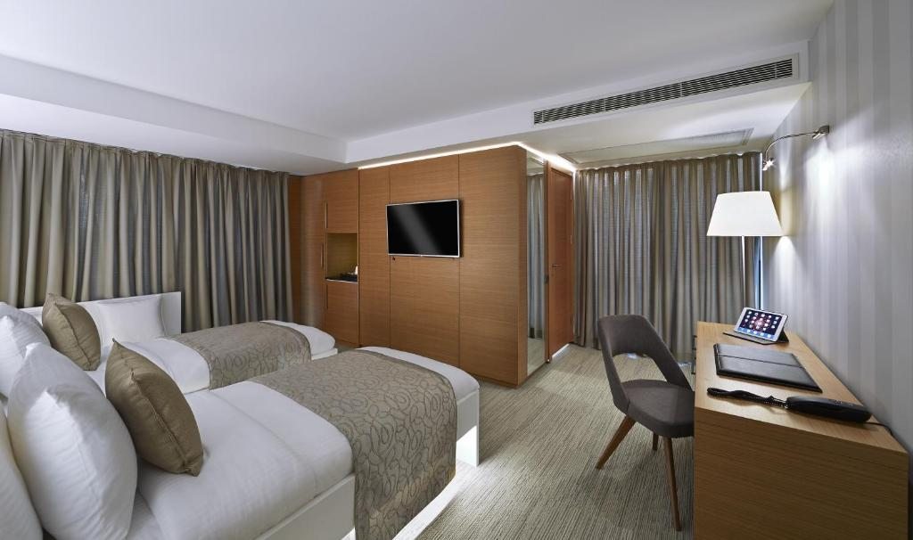 Двухместный (Улучшенный двухместный номер с 2 отдельными кроватями) отеля Milport Levent Istanbul, Стамбул
