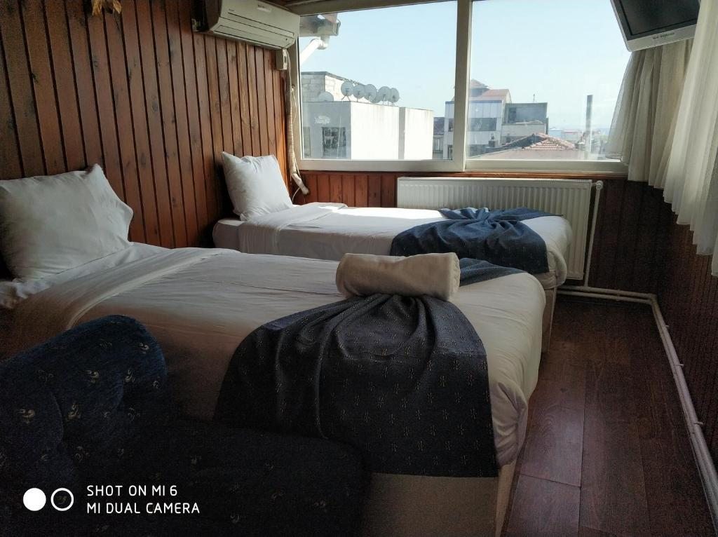 Трехместный (Классический трехместный номер) отеля Hotel Akkus, Стамбул