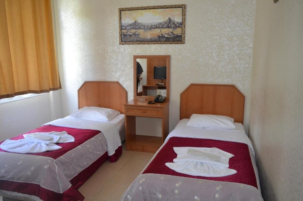 Двухместный (Двухместный номер эконом-класса с 2 отдельными кроватями и общей ванной комнатой) отеля Hotel Ekol, Стамбул