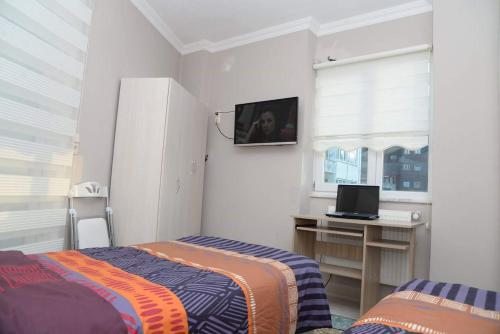 Двухместный (Двухместный номер с 1 кроватью или 2 отдельными кроватями и балконом с видом на город) апарт-отеля Trabzon Apart Nuralp, Трабзон