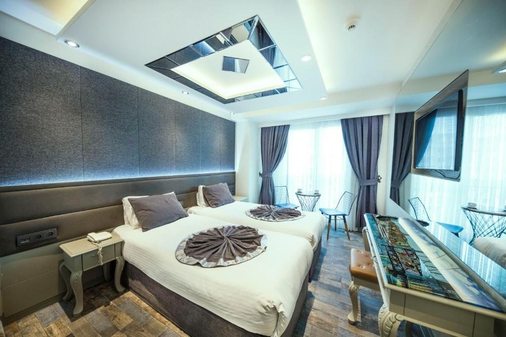 Двухместный (Улучшенный двухместный номер с 1 кроватью или 2 отдельными кроватями) отеля Parmada Hotel Old City, Стамбул