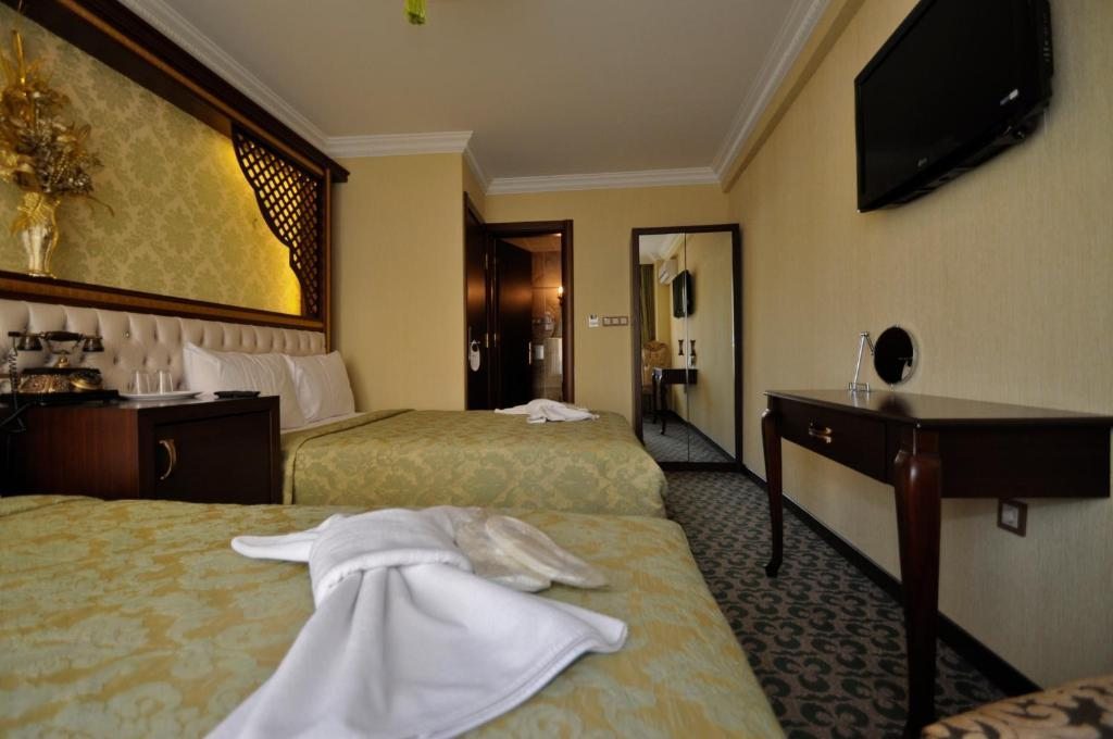 Двухместный (Улучшенный двухместный номер с 2 отдельными кроватями) отеля Salinas Istanbul Hotel, Стамбул