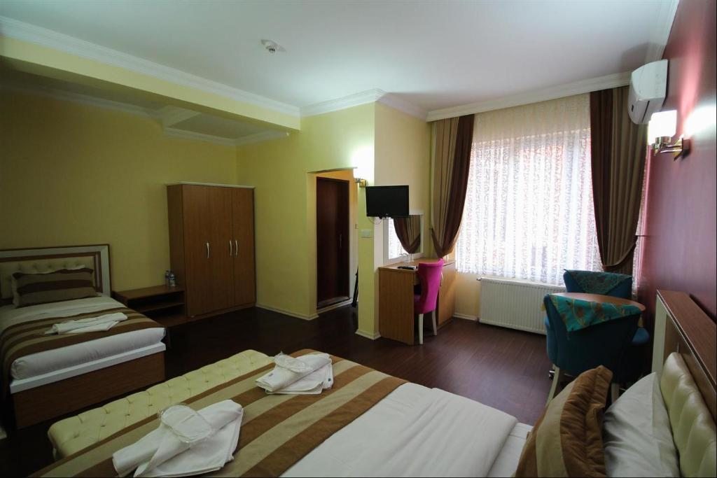Двухместный (Стандартный двухместный номер с 2 отдельными кроватями) апарт-отеля Azre Hotel, Стамбул