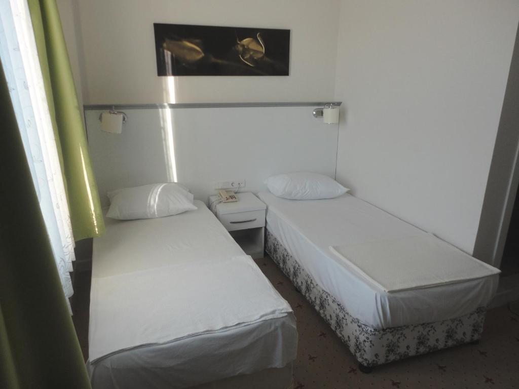 Двухместный (Стандартный двухместный номер с 2 отдельными кроватями и частичным видом на море) отеля Cicek Hotel & Apartments, Фетхие