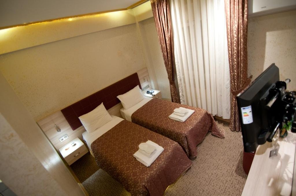 Двухместный (Бюджетный двухместный номер с 2 отдельными кроватями) отеля Hotel Aslan Istanbul, Стамбул