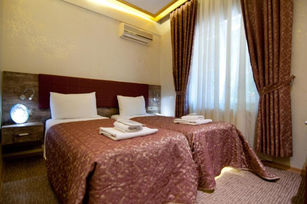 Двухместный (Стандартный двухместный номер с 2 отдельными кроватями) отеля Hotel Aslan Istanbul, Стамбул