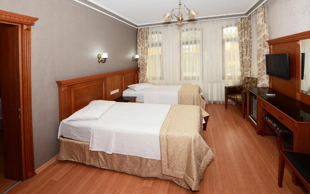 Трехместный (Стандартный трехместный номер) отеля Hotel New House, Стамбул