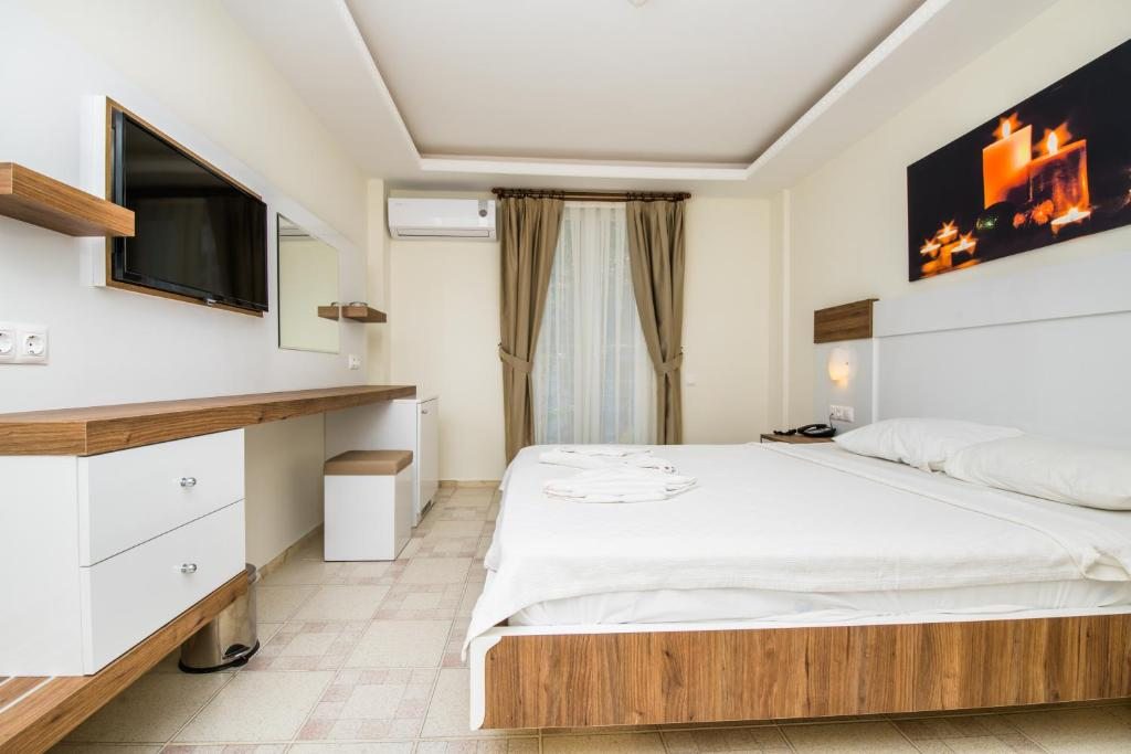 Двухместный (Двухместный номер с 1 кроватью или 2 отдельными кроватями и видом на море) отеля Soothe Hotel, Калкан