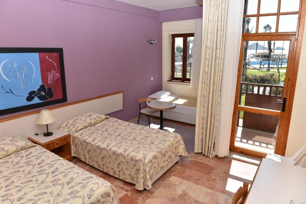 Двухместный (Двухместный номер с 1 кроватью или 2 отдельными кроватями - Подходит для гостей с ограниченными физическими возможностями) курортного отеля Club Tuana Fethiye - All Inclusive, Фетхие