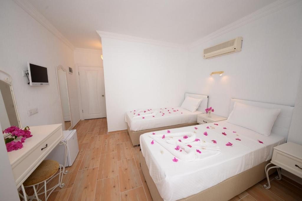 Двухместный (Стандартный двухместный номер с 1 кроватью или 2 отдельными кроватями) семейного отеля Neruda Pension, Калкан
