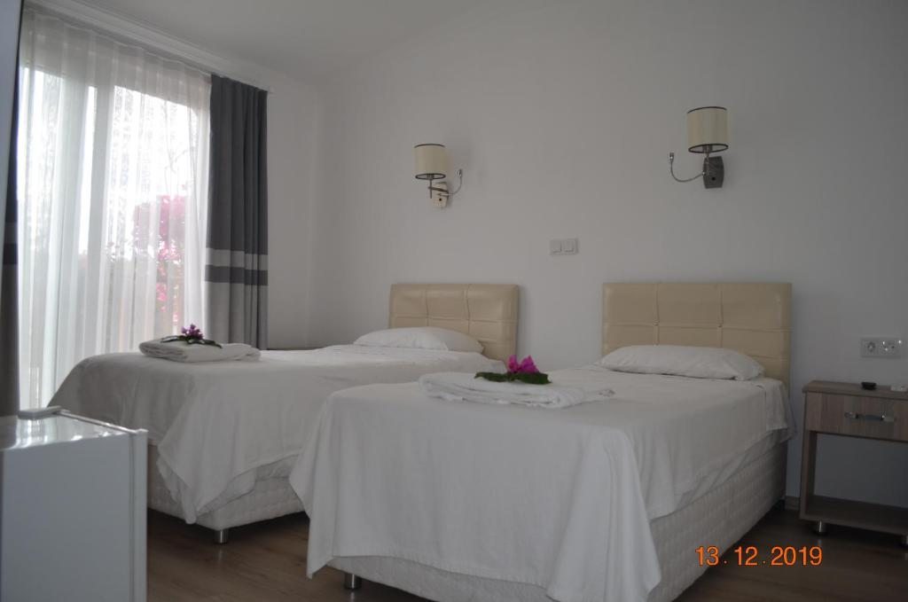 Двухместный (Стандартный двухместный номер с 1 кроватью или 2 отдельными кроватями) отеля Hotel Uygar, Фетхие