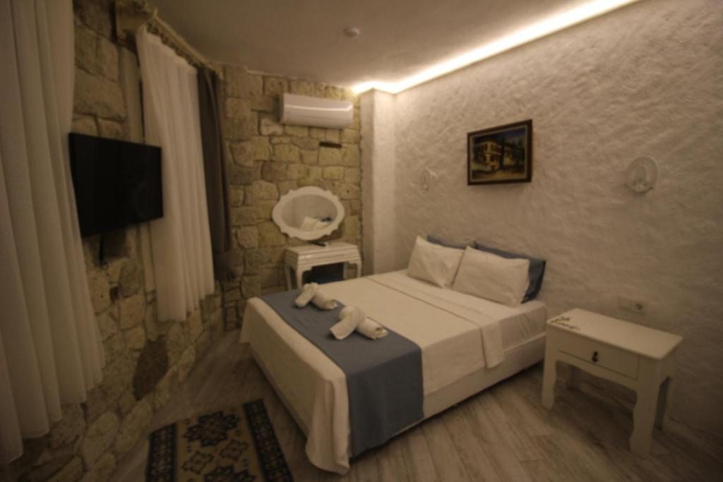Двухместный (Двухместный номер Делюкс с 1 кроватью) отеля Alacati Asmali Konak Hotel, Алачати