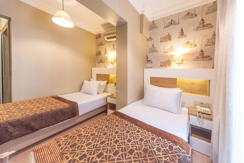 Двухместный (Стандартный двухместный номер с 2 отдельными кроватями) отеля Tayahatun Hotel, Стамбул