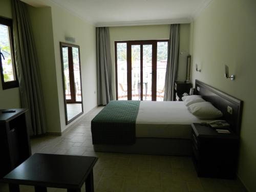 Двухместный (Двухместный номер Делюкс с 1 кроватью или 2 отдельными кроватями) отеля Flamingo, Олюдениз