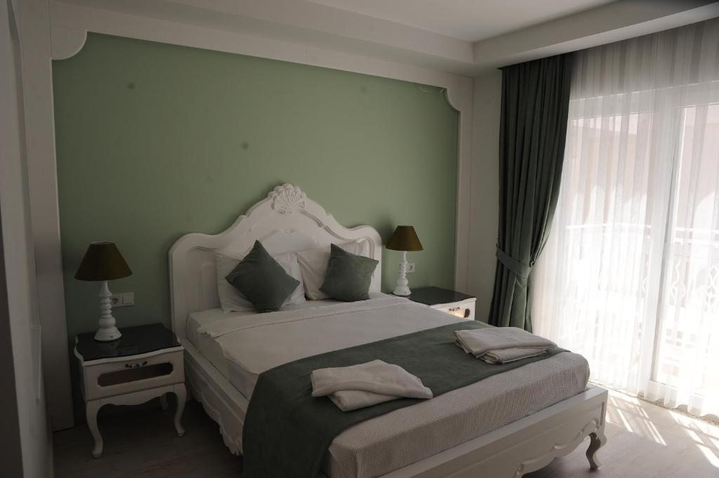 Двухместный (Двухместный номер с 1 кроватью или 2 отдельными кроватями) отеля Montebello Deluxe Hotel, Олюдениз