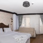 Трехместный (Трехместный номер Делюкс с частичным видом на море), Mytra Hotel