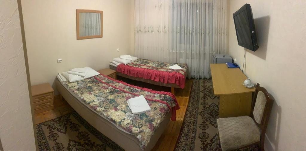 Двухместный (Улучшенный двухместный номер с 2 отдельными кроватями) отеля Губернский, Мурманск