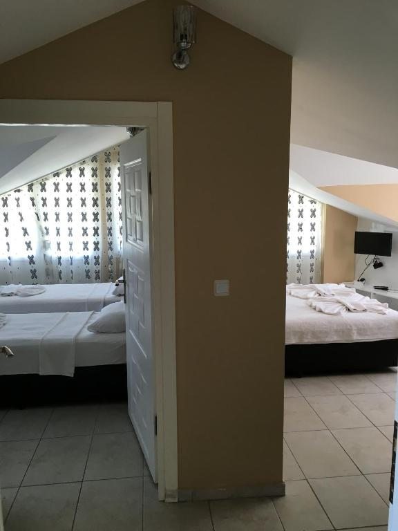 Сьюит (Люкс без балкона (для 4 взрослых)) отеля Green Peace Hotel, Олюдениз