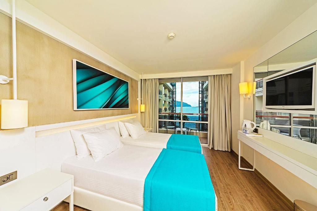 Двухместный (Стандартный двухместный номер с 1 кроватью или 2 отдельными кроватями, вид на море) отеля Poseidon Hotel - Scene concept, Мармарис