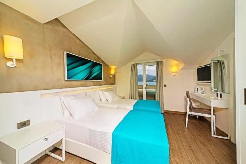 Двухместный (Двухместный номер с 1 кроватью или 2 отдельными кроватями - Мансарда) отеля Poseidon Hotel - Scene concept, Мармарис