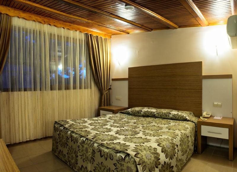 Семейный (Двухуровневый номер + 1 ребенок) курортного отеля Omer Holiday Resort - All Inclusive, Кушадасы