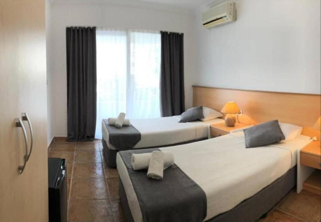 Двухместный (Стандартный двухместный номер с 1 кроватью или 2 отдельными кроватями) семейного отеля Mimosa Pension, Каш