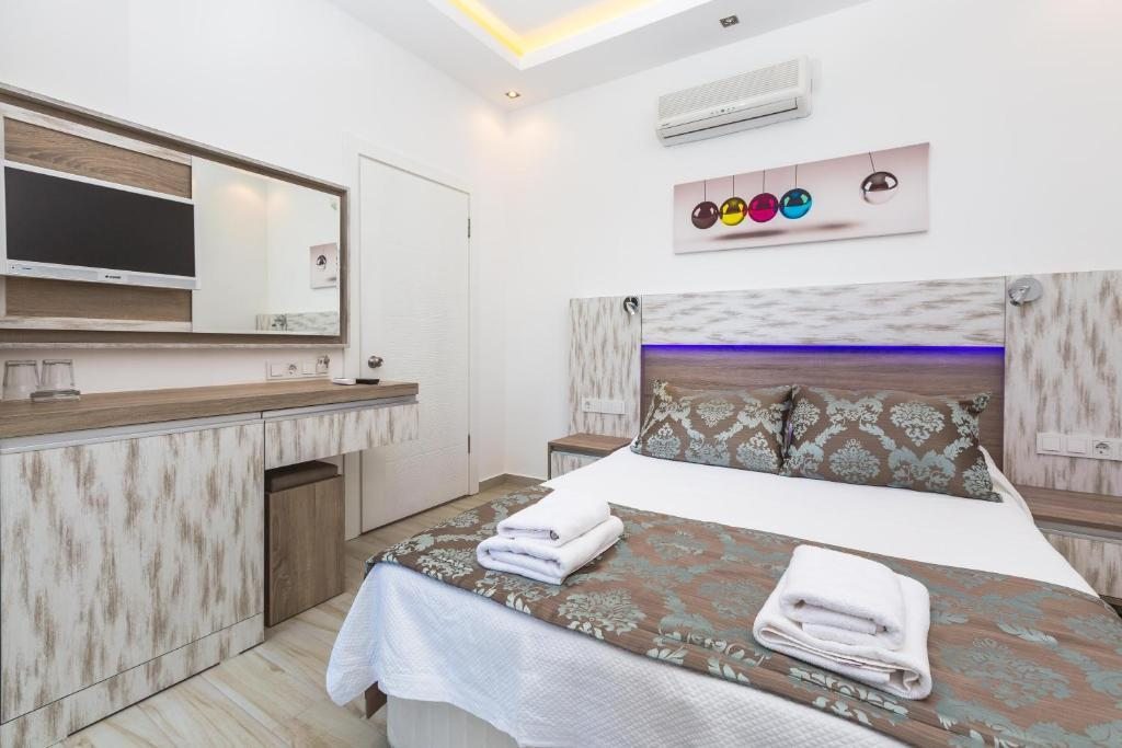 Двухместный (Двухместный номер с 1 кроватью или 2 отдельными кроватями и собственной ванной комнатой) отеля Sardunya Andifli Otel, Каш