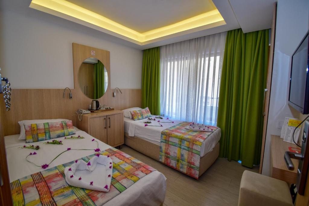 Двухместный (Стандартный двухместный номер с 2 отдельными кроватями) отеля City Hotel Marmaris, Мармарис