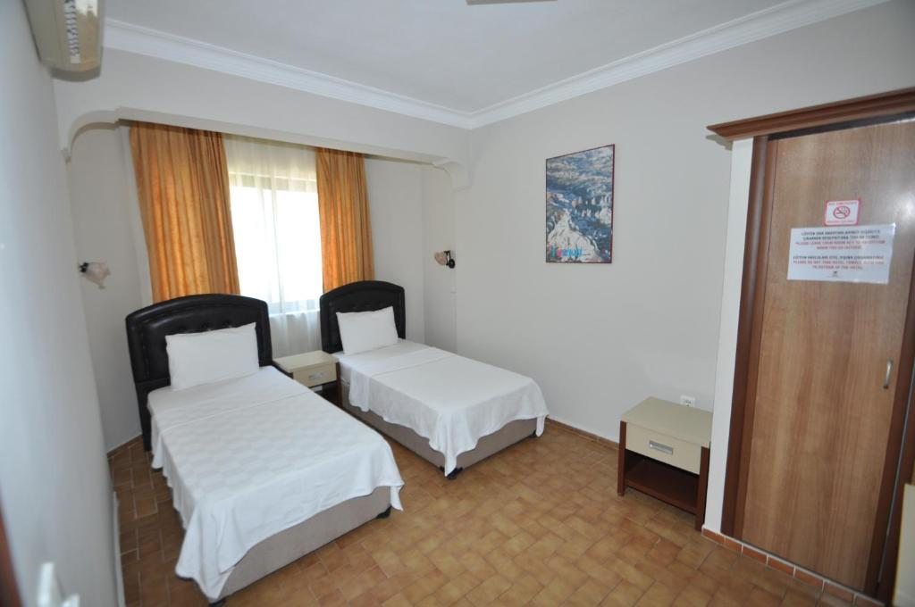 Двухместный (Стандартный двухместный номер с 2 отдельными кроватями) апарт-отеля Defne & Zevkim Hotel, Мармарис