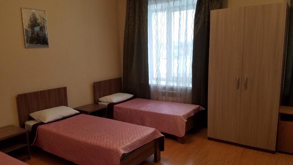 Двухместный (Бюджетный двухместный номер с 2 отдельными кроватями) гостиницы СПОРТ, Уссурийск