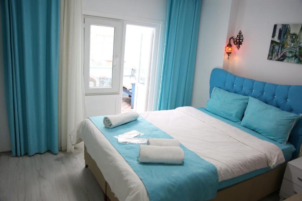 Двухместный (Двухместный номер с 1 кроватью и балконом (для 2 взрослых и 1 ребенка)) апарт-отеля Halena Apartment, Стамбул
