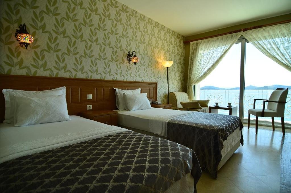 Двухместный (Двухместный номер с 2 отдельными кроватями и видом на море) отеля Cunda Kivrak, Айвалык