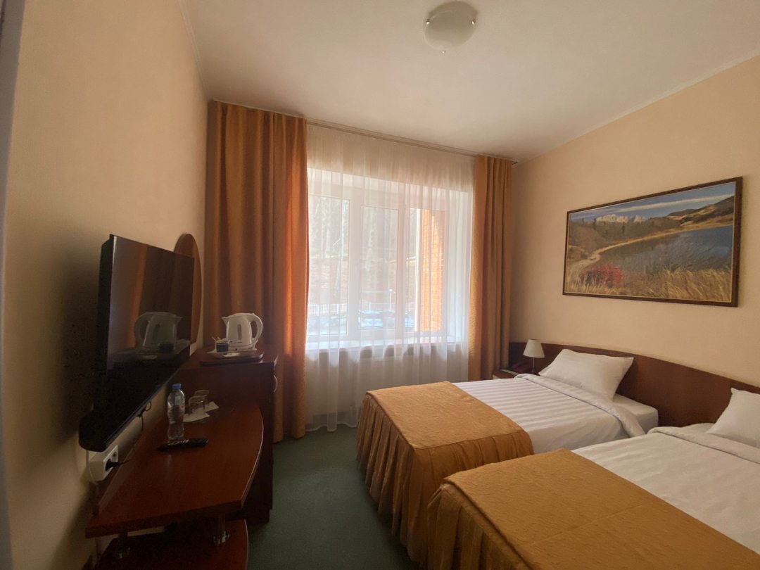 Двухместный (Небольшой двухместный номер с 2 отдельными кроватями) отеля Гуамка
