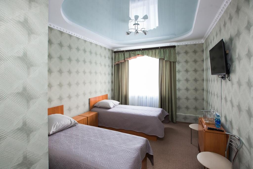 Двухместный (Двухместный номер Делюкс с 2 отдельными кроватями) отеля Inn Men`s House, Якутск