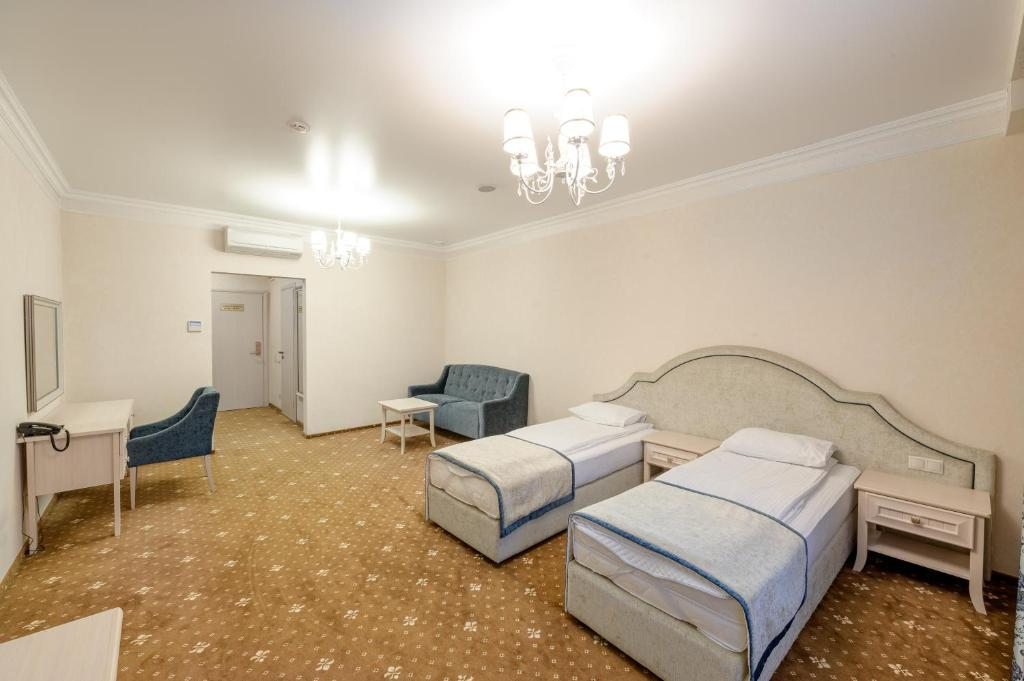 Двухместный (Улучшенный двухместный номер с 1 кроватью или 2 отдельными кроватями) отеля Аквамарин, Сургут