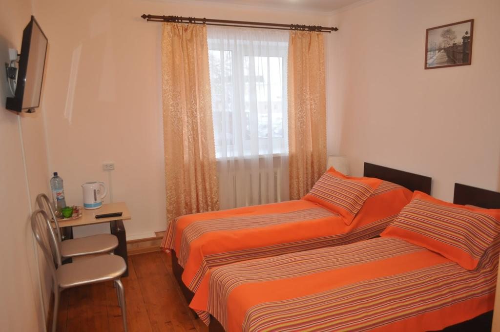 Двухместный (Двухместный номер с 2 отдельными кроватями и собственной ванной комнатой) мини-отеля Ершов, Ишим