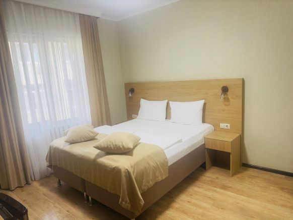 Фотография номера гостиницы Грейс Времена Года